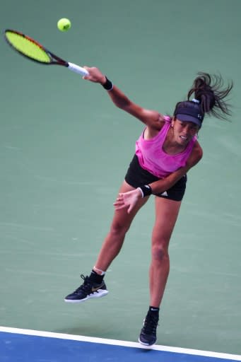 Hsieh Su-Wei of Taiwan hits a return against Caroline Wozniacki of Denmark during their first round women's singles match at the Wuhan Open tennis tournament