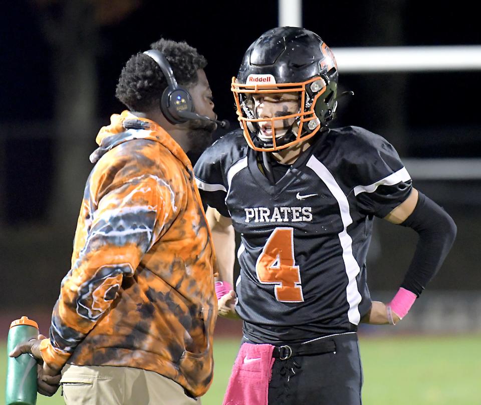 As Oxford offensive coordinator last fall, James Royster outlines a play for QB Lucas Lambert.