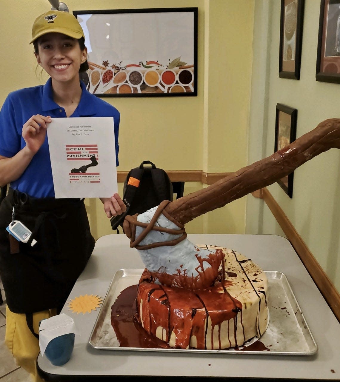 Doña Ana Community College Student Eva Perez poses with her Edible Storybook Contest entry, "Crime & Punishment" held April 9, 2022 at New Mexico State University.