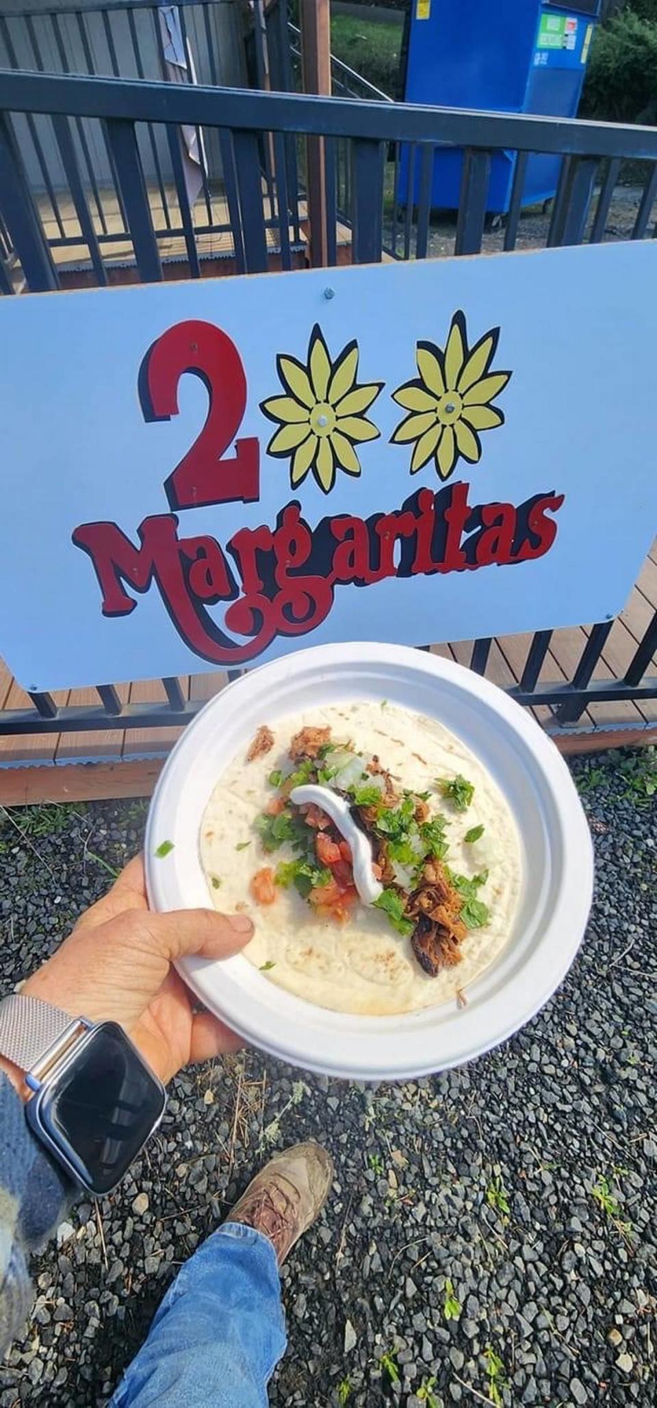 Richard and Cheryl Miller cooked free tacos in the 2 Margaritas parking lot.