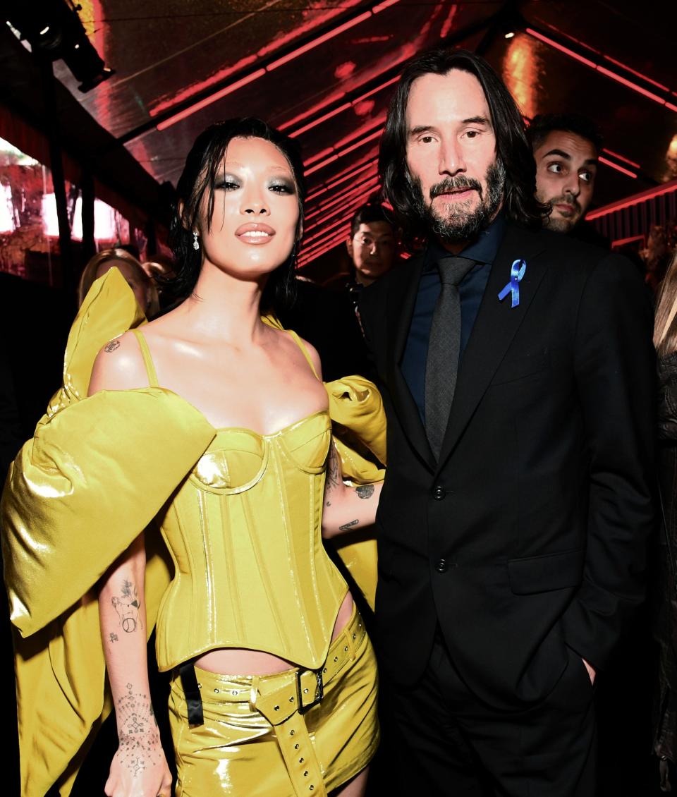 Rina Sawayama, left, and Keanu Reeves at the Los Angeles premiere of "John Wick: Chapter 4."