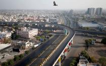 FILE PHOTO: A view shows empty roads during a 14-hour long curfew to limit the spreading of coronavirus disease (COVID-19) in the country, in Ahmedabad