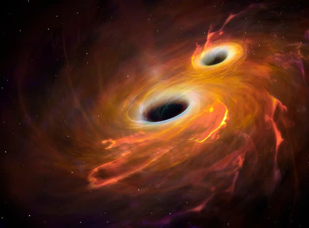 Ilustración de dos agujeros negros. (Photo: MARK GARLICK via Getty Images/Science Photo Libra)
