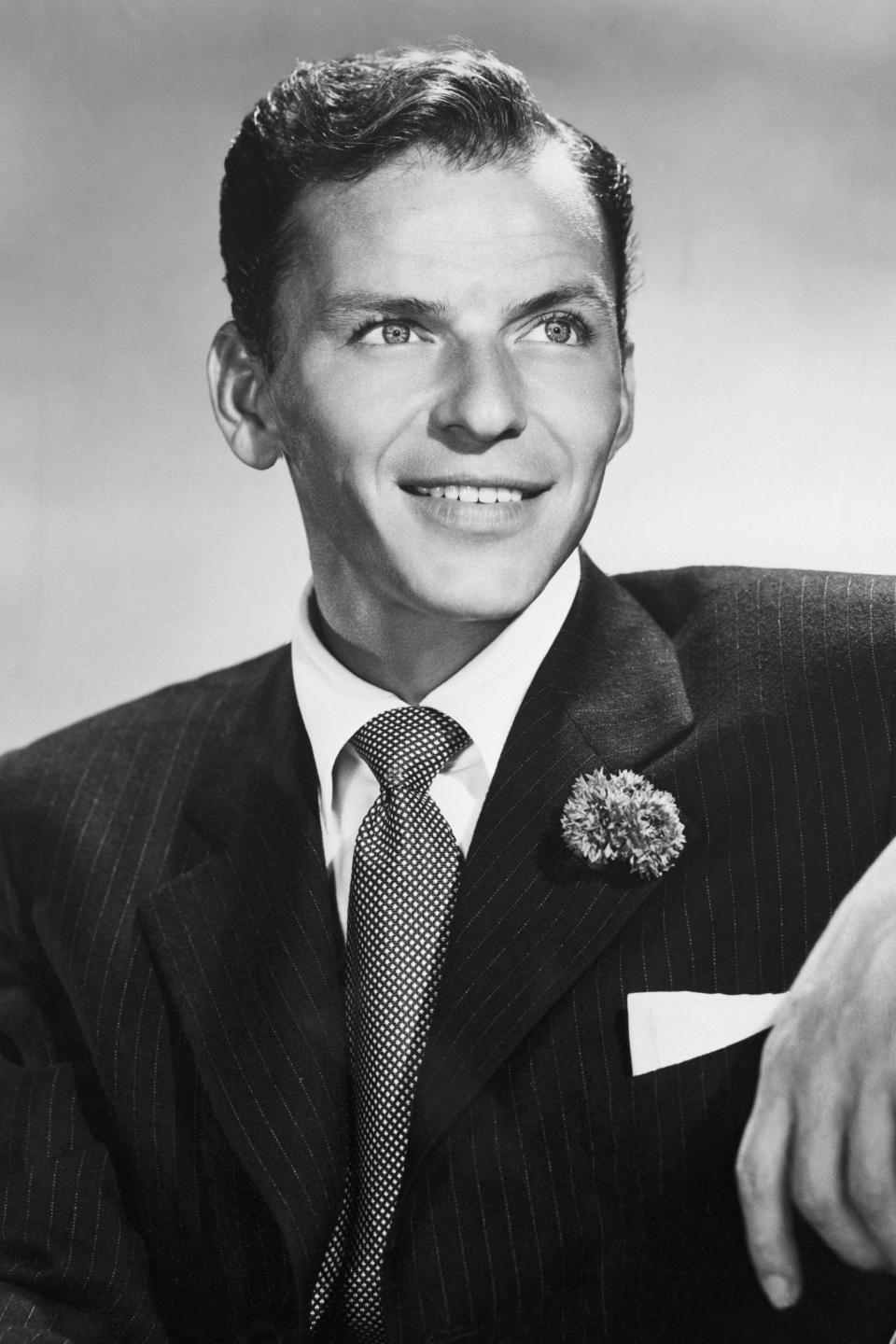 Vintage portrait of Frank Sinatra in a suit with a boutonniere