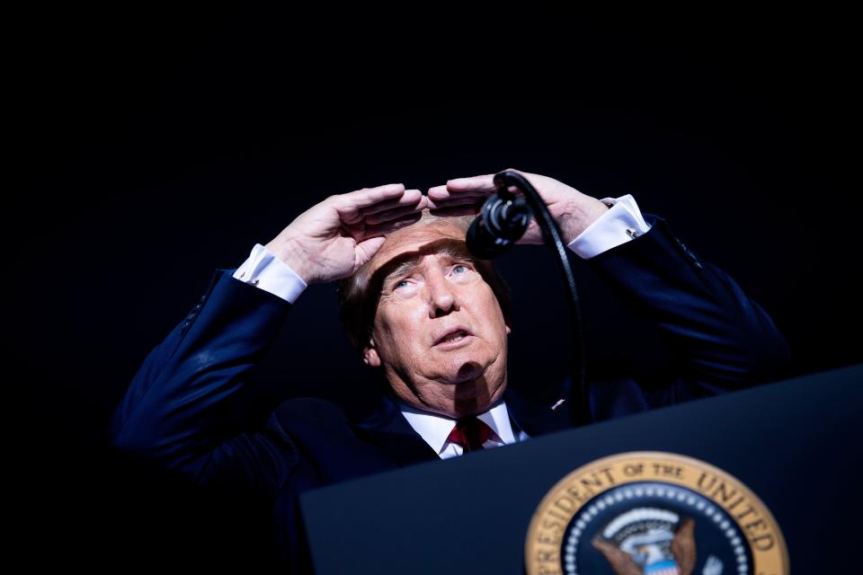 President Donald Trump looks at the crowd Saturday night during a campaign rally at the Minden-Tahoe Airport in Minden, Nevada. The rally was Trump's opening event on a three-day campaign swing through the West.