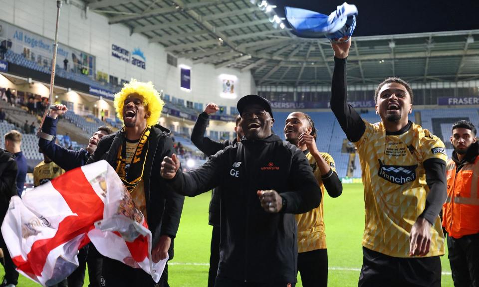 <span>George Elokobi and his Maidstone players were determined to enjoy the occasion after their unforgettable FA Cup run.</span><span>Photograph: Darren Staples/AFP/Getty Images</span>