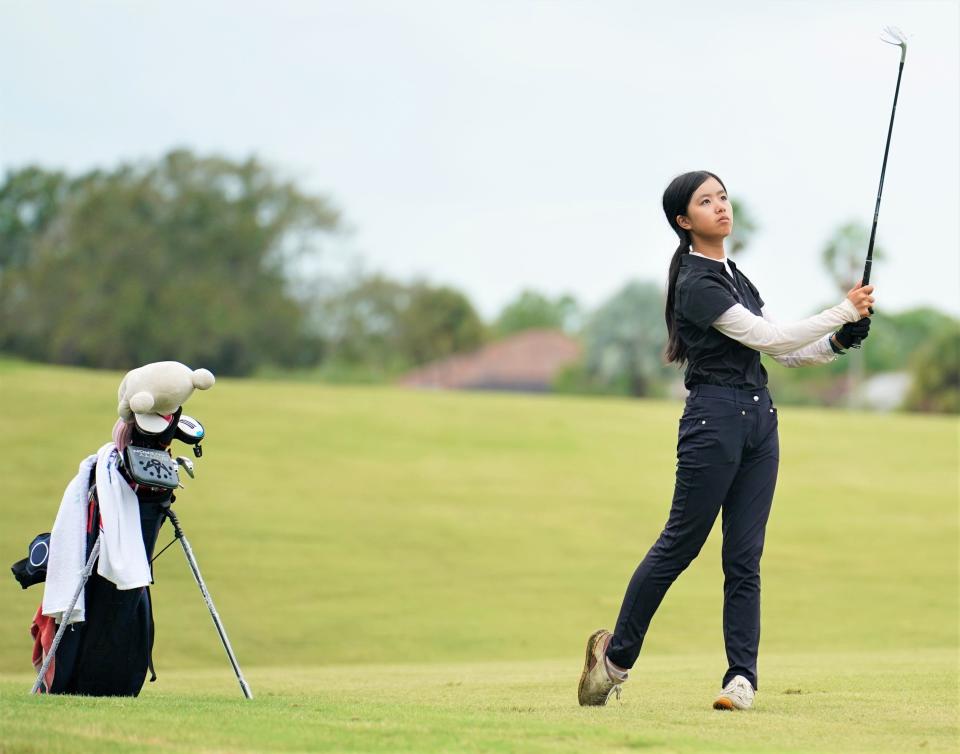 Jensen Beach's Claire Liu watches her approach shot on the third hole at Meadowood Golf and Tennis Club during the Treasure Lake Conference Championships on Monday, Oct. 9, 2023 in Fort Pierce. Liu shot a 1-over 73 to earn medalist honors.