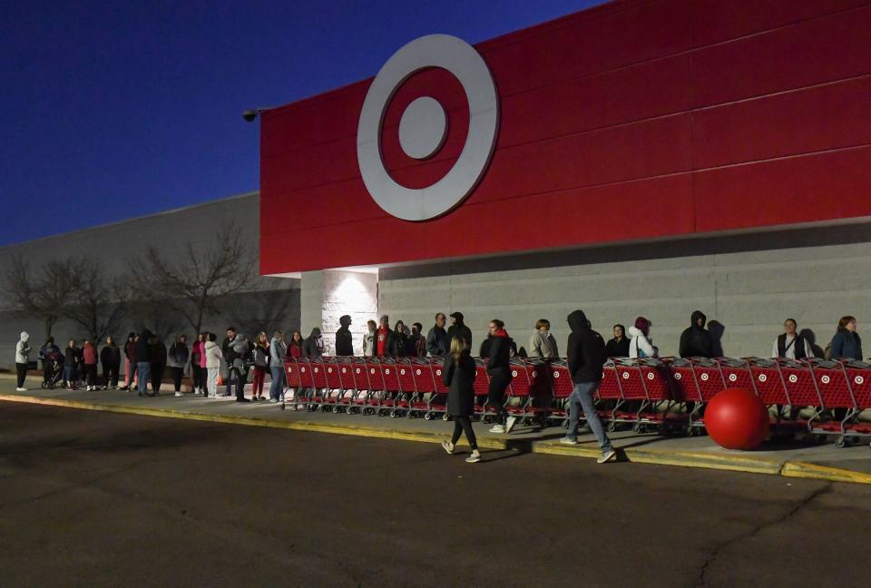 A line of about 40 people gathers shortly before doors open at Target on Black Friday morning, November 25, 2022, in Sioux Falls.