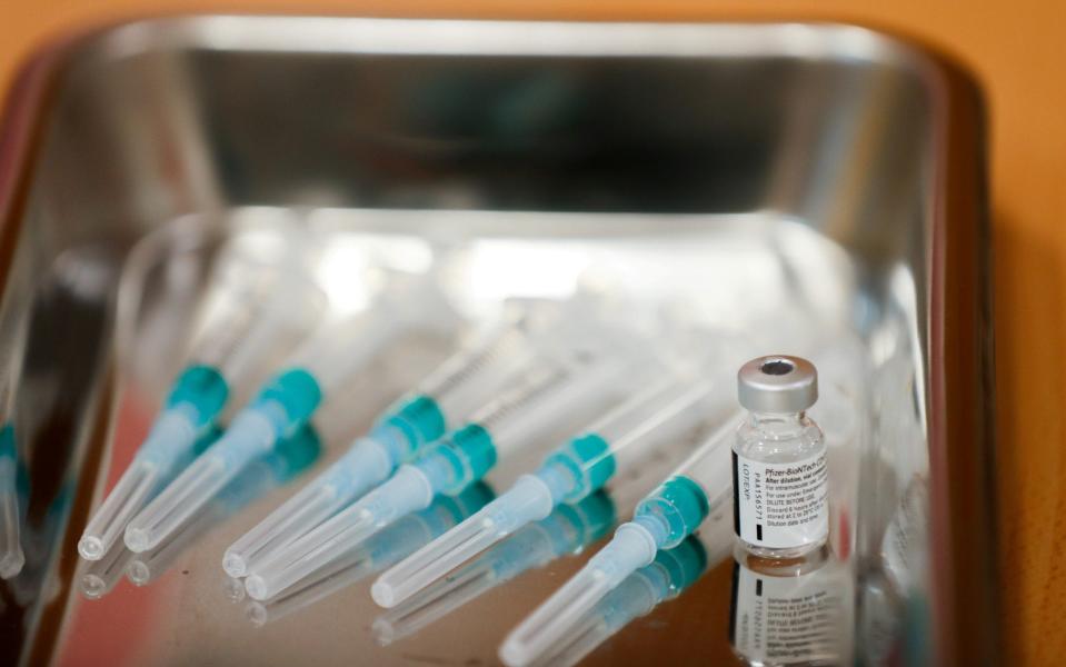 FILE PHOTO: Syringes and a dose of the Pfizer-BioNTech COVID-19 vaccine are seen at the elderly home Ballesol, as the coronavirus disease (COVID-19) outbreak continues, in Madrid, Spain January 25, 2021. REUTERS/Susana Vera/File Photo - SUSANA VERA/REUTERS