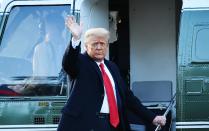 Outgoing US President Donald Trump waves as he boards Marine One at the White House in Washington, DC, on January 20, 2021. - President Trump travels his Mar-a-Lago golf club residence in Palm Beach, Florida, and will not attend the inauguration for President-elect Joe Biden. (Photo by MANDEL NGAN / AFP) (Photo by MANDEL NGAN/AFP via Getty Images)