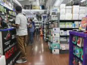 Customers browse electronic parts and equipment at BizGram in Sim Lim Square in Singapore January 30, 2018. Picture taken January 30, 2018. REUTERS/Dewey Sim