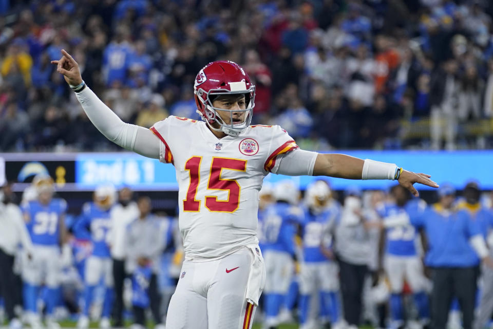 Kansas City Chiefs quarterback Patrick Mahomes reacts after throwing a touchdown pass to wide receiver Tyreek Hill during the second half of an NFL football game against the Los Angeles Chargers, Thursday, Dec. 16, 2021, in Inglewood, Calif. (AP Photo/Marcio Jose Sanchez)