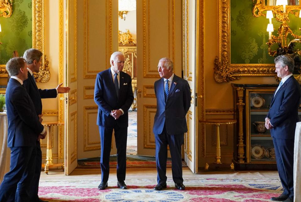 US Special Presidential Envoy for Climate John Kerry, second left, speaks to U.S. President Joe Biden, centre left and Britain's King Charles III during a climate engagement with philanthropists and investors at Windsor Castle, in Windsor, England, Monday, July 10, 2023.