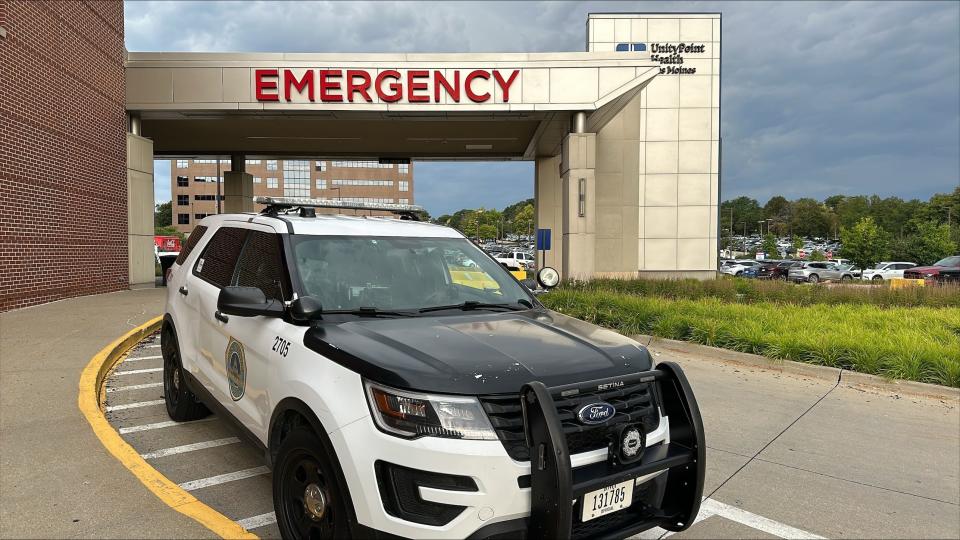 A Des Moines police vehicle sits outside the emergency department at UnityPoint Health - Iowa Methodist Medical Center, where a police officer is being treated after being shot on Tuesday, July 30, 2024.