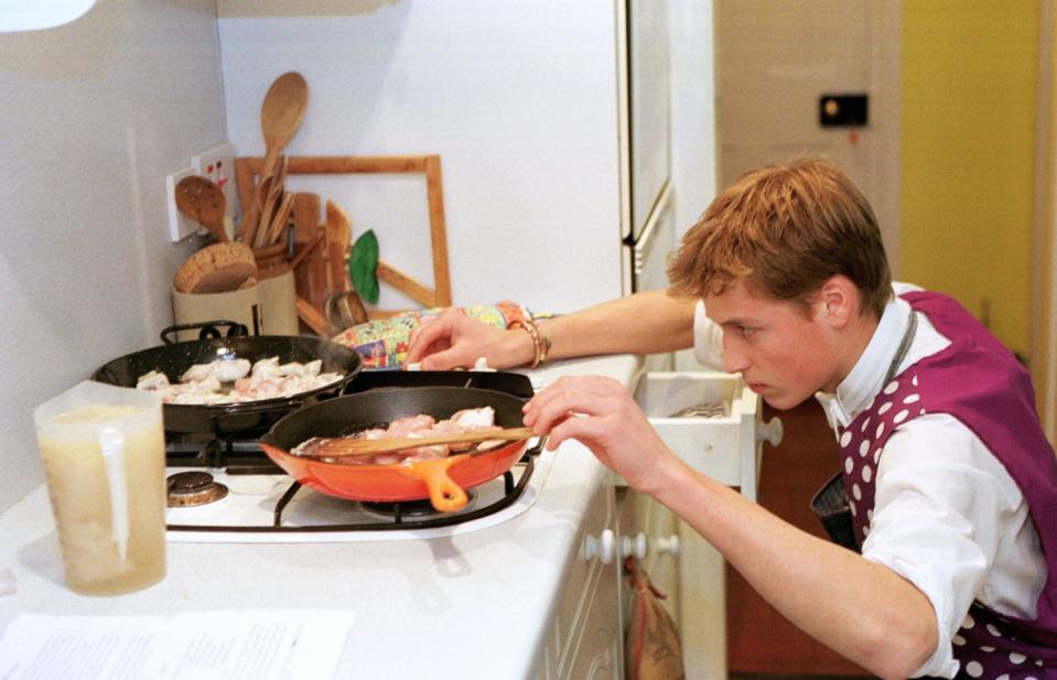 <p>Prince William channels his inner chef, making chicken paella as a student at Eton College. </p>