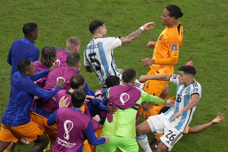 A scuffle breaks out between players during the World Cup quarterfinal soccer match between the Netherlands and Argentina, at the Lusail Stadium in Lusail, Qatar, Friday, Dec. 9, 2022. (AP Photo/Thanassis Stavrakis)