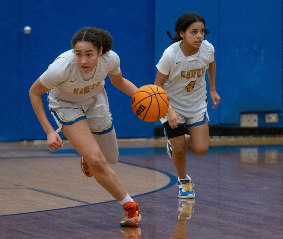 Manchester Devyn Quigley drives down the court with Marisiya  Goins close behind. Manchester Girls Basketball defeats Lacey in Manchester on January 24, 2023.