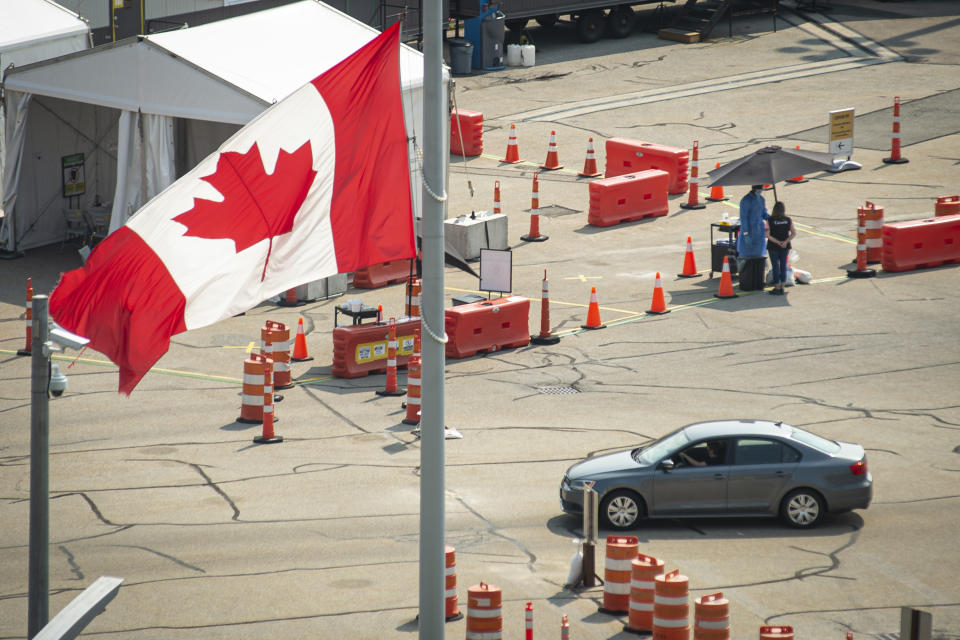 FILE - A car crosses the border into Canada, in Niagara Falls, Ontario, on Aug. 9, 2021. American citizens and permanent residents are now allowed to enter Canada for non-essential purposes if they can provide proof that they've been fully vaccinated for at least 14 days. (Eduardo Lima/The Canadian Press via AP, File)