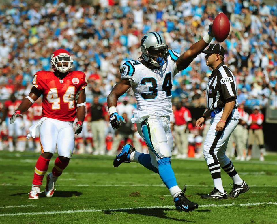 10/05/08 Carolina Panthers running back DeAngelo Williams (34) holds the ball high as he runs into the end zone leaving Kansas City Chiefs’ safety Jarrad Page behind. The touchdown run was the first of Williams’ three touchdown runs as the Panthers defeated the Chiefs 34-0.