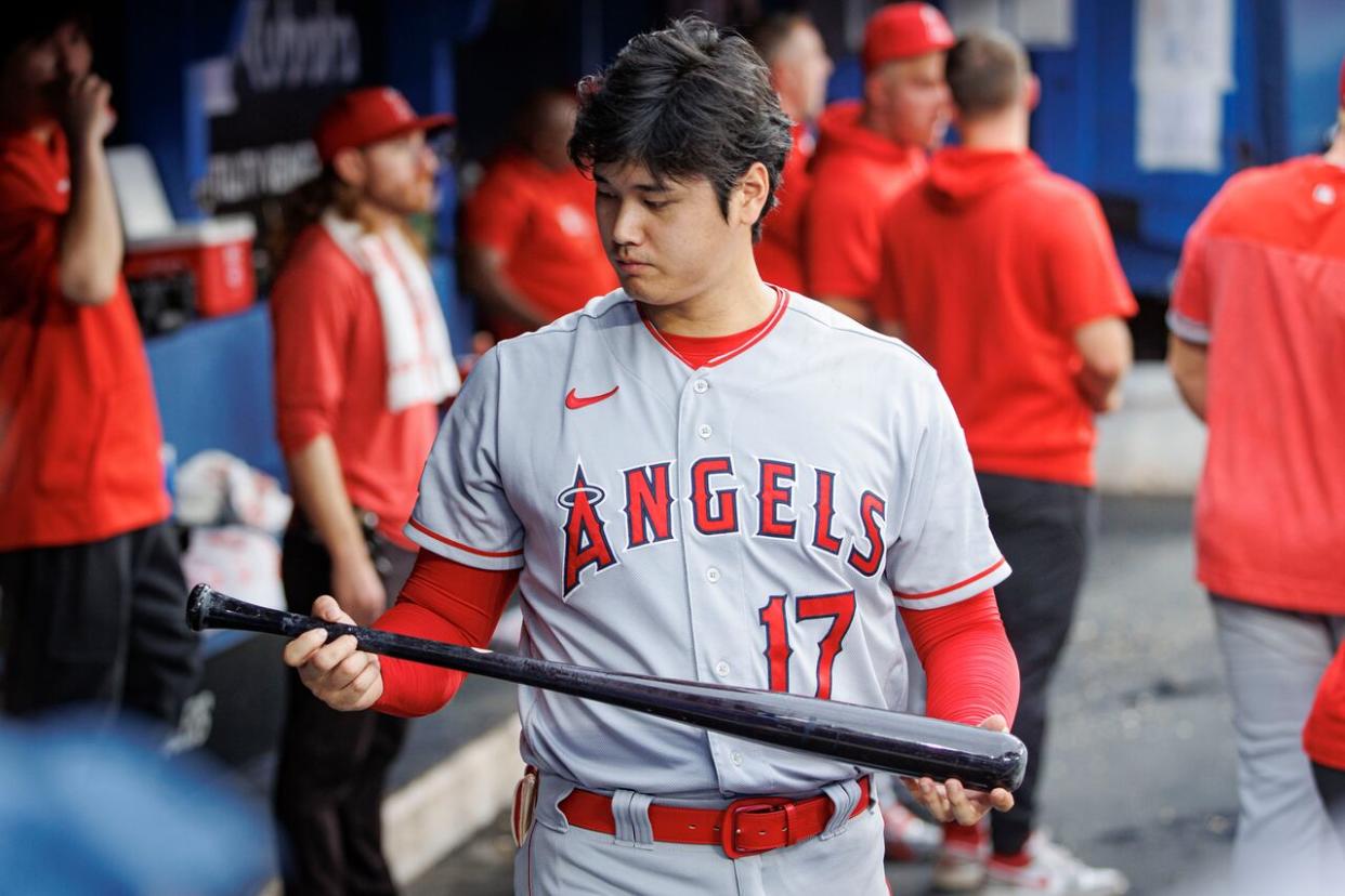 Los Angeles Angels designated hitter Shohei Ohtani inspects a bat before hitting against the Blue Jays in July during the first of a three-game series in Toronto. (Evan Mitsui/CBC - image credit)