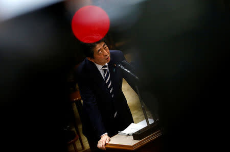 Japan's Prime Minister Shinzo Abe answers a question during an upper house parliamentary session in Tokyo, Japan March 19, 2018. REUTERS/Issei Kato