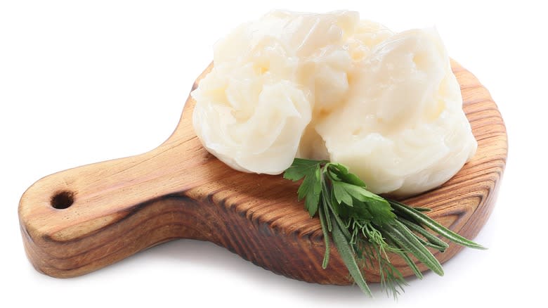 solid beef tallow with fresh herbs