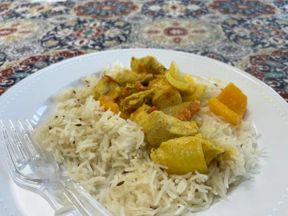 After a Santhoshi’s Kitchen’s cooking class, the guests will sit down to eat their creation. Here, the dish is chicken tikka masala and jeera rice. Heidi Finley/CharlotteFive