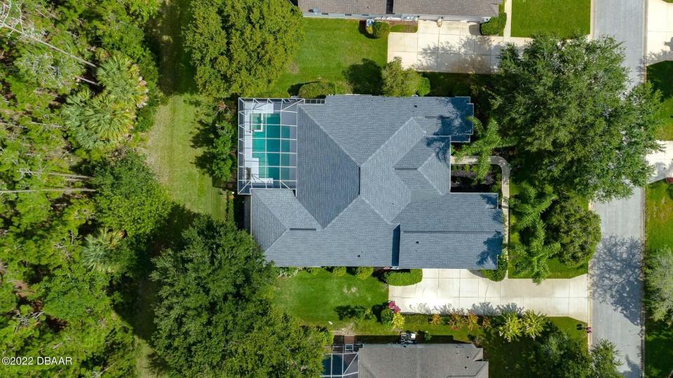 Lots of trees give added privacy to this custom-built home in Breakaway Trails.