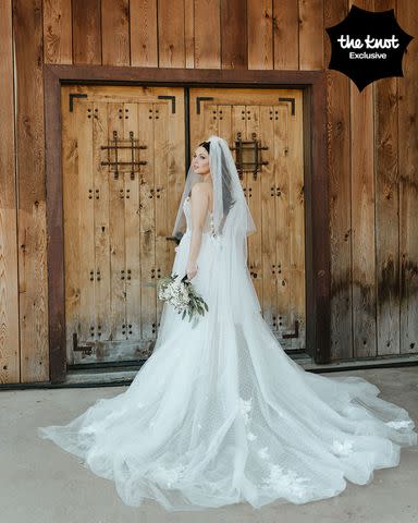 <p>Michelle Roller</p> Samatha Hanratty wore a tulle wedding dress detailed with Swiss dots.