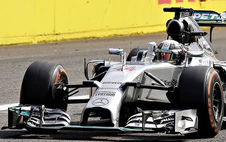 Mercedes Formula One driver Lewis Hamilton celebrates winning the \Italian F1 Grand Prix in Monza September 7, 2014. REUTERS/Max Rossi