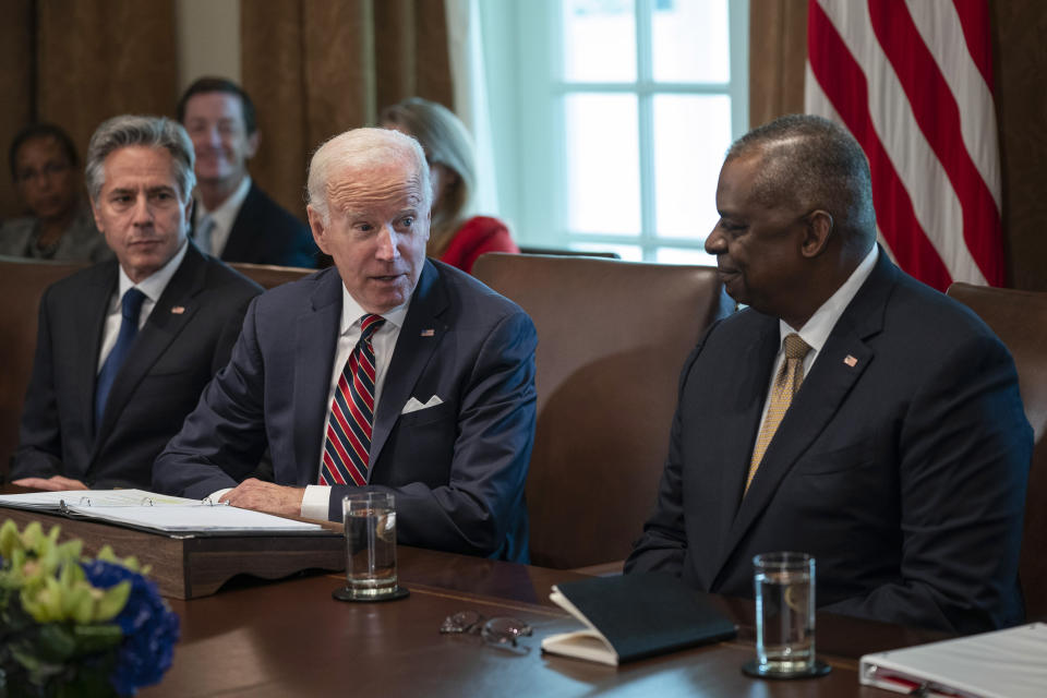 Secretary of State Antony Blinken, left, and Secretary of Defense Lloyd Austin, right, listen as President Joe Biden speaks during a cabinet meeting at the White House, Tuesday, Sept. 6, 2022, in Washington. (AP Photo/Evan Vucci)