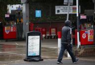 A sign informing customers that fuel has run out is pictured at a Texaco fuel station in London