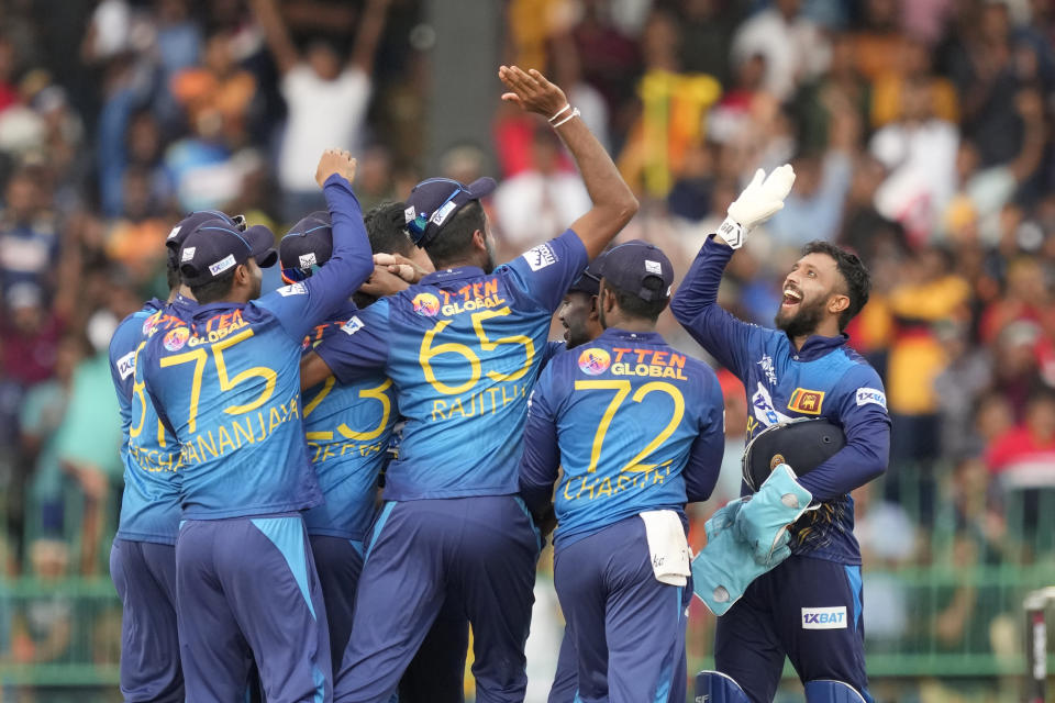 Sri Lankan team members celebrates the dismissal of India's Hardik Pandya during the Asia Cup cricket match between Sri Lanka and India in Colombo, Sri Lanka, Tuesday, Sept. 12, 2023. (AP Photo/Eranga Jayawardena)