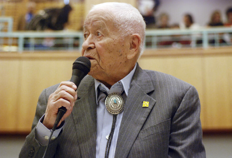 FILE - In this Feb. 2, 2018, fle photo Democratic New Mexico state Sen. John Pinto talks about his career as a lawmaker on American Indian Day in the Legislature on in Santa Fe, N.M. Pinto joined the Senate in 1977 and is 92 years old. He was a Marine who trained as a Navajo code talker during World War II. His singing of the "Potato Song" is an annual Senate ritual. (AP Photo/Morgan Lee, File)