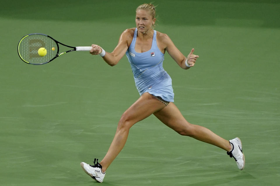 Shelby Rogers returns a shot to Jelena Ostapenko, of Latvia, at the BNP Paribas Open tennis tournament Wednesday, Oct. 13, 2021, in Indian Wells, Calif. (AP Photo/Mark J. Terrill)