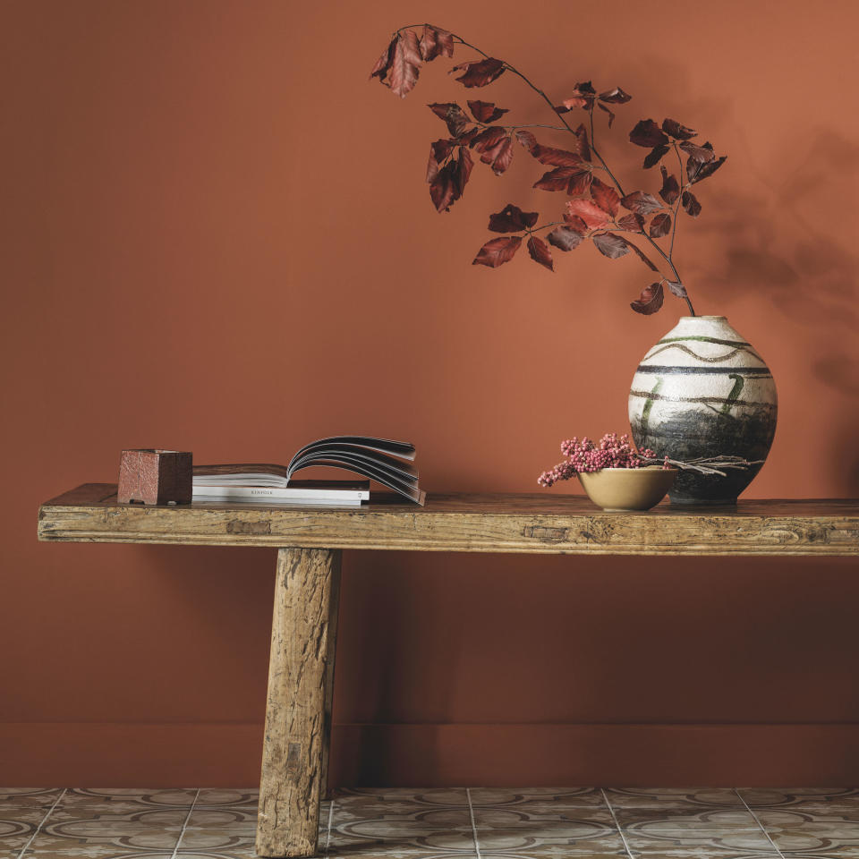 Terracotta walls with wooden bench