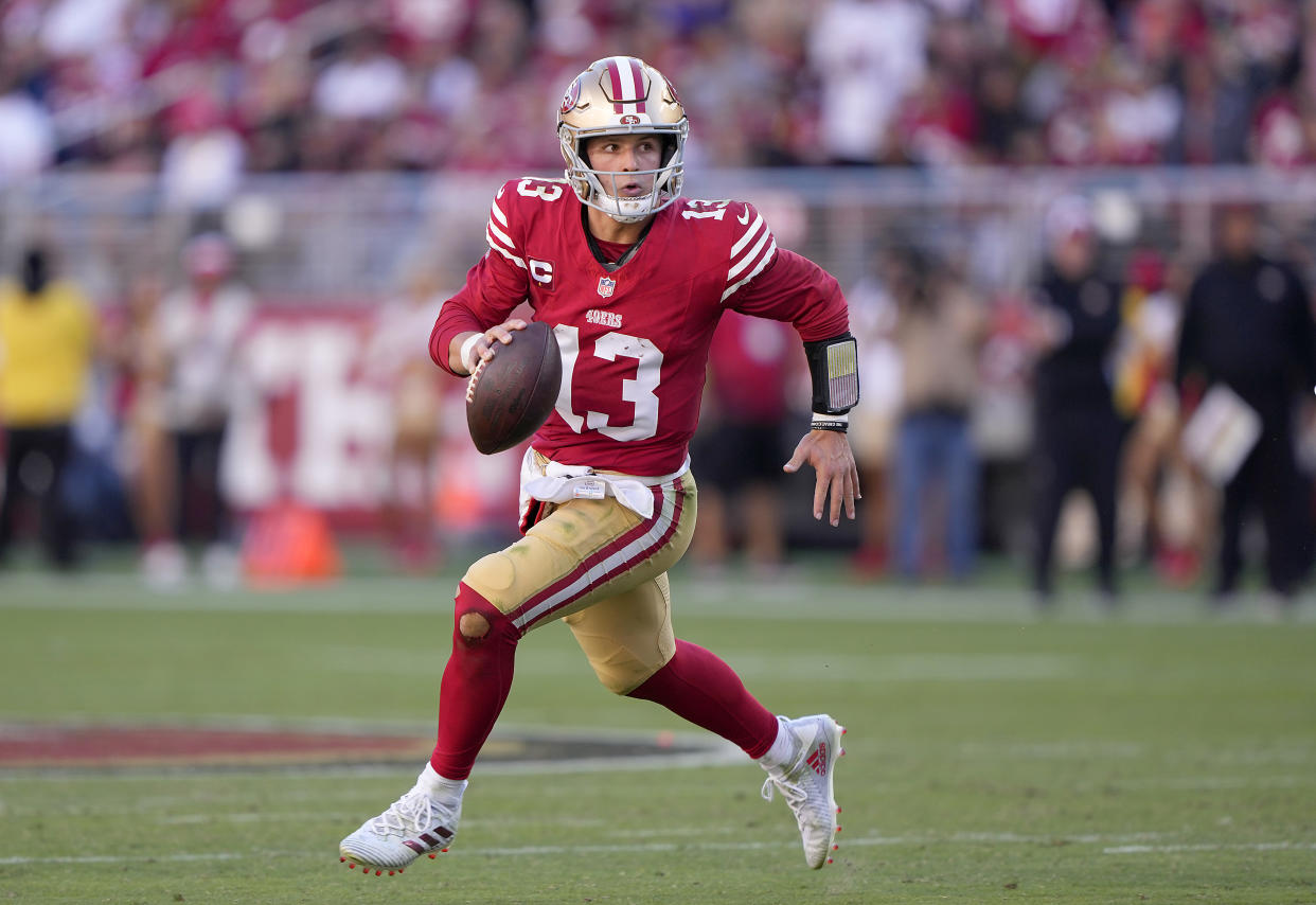 SANTA CLARA, CALIFORNIA - OCTOBER 29: Brock Purdy #13 of the San Francisco 49ers scrambles with the ball looking to pass against the Cincinnati Bengals during the fourth quarter of an NFL football game at Levi's Stadium on October 29, 2023 in Santa Clara, California. (Photo by Thearon W. Henderson/Getty Images)