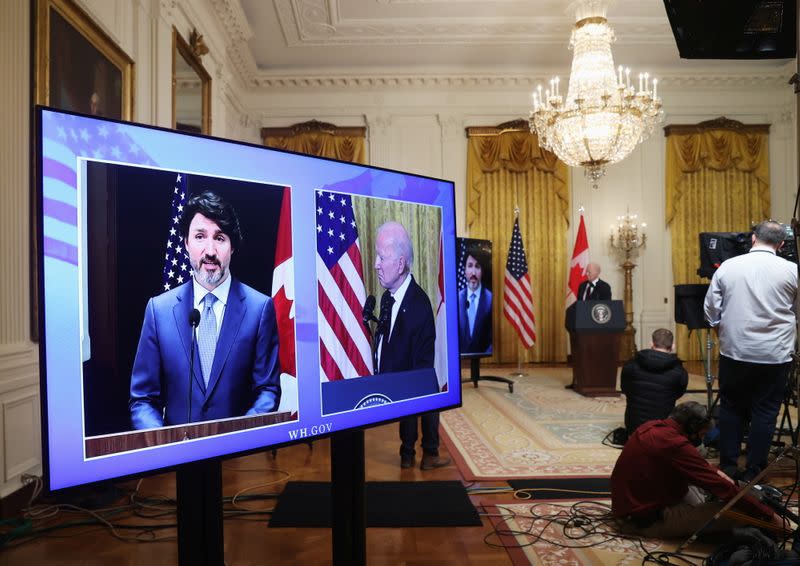 U.S. President Joe Biden and Canada’s Prime Minister Justin Trudeau, appearing via video conference call, give closing remarks at the end of their virtual bilateral meeting from the White House in Washington