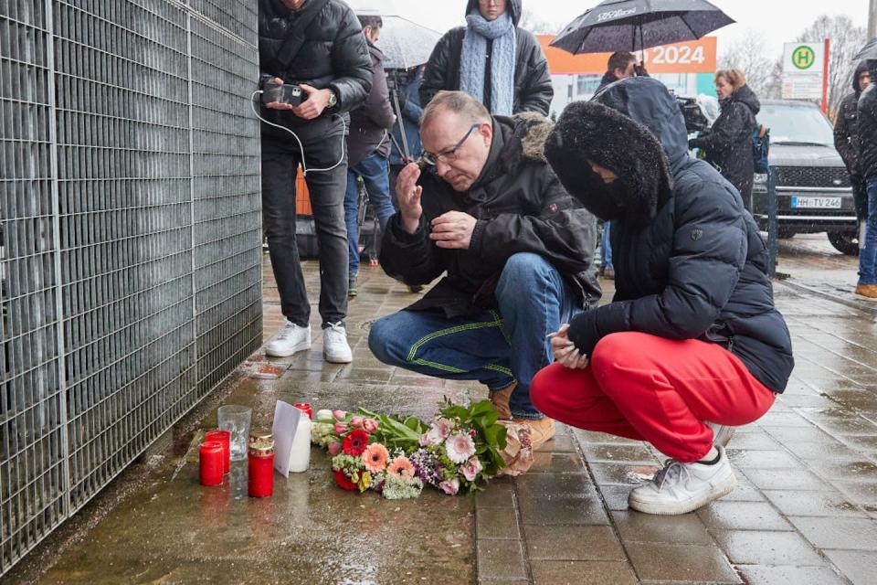 A man crosses himself outside the Jehovah’s Witnesses building in Hamburg where several people were killed during a shooting March 9, 2023. <a href="https://www.gettyimages.com/detail/news-photo/march-2023-hamburg-a-man-crosses-himself-at-the-jehovahs-news-photo/1247993511?phrase=jehovah%27s%20witnesses&adppopup=true" rel="nofollow noopener" target="_blank" data-ylk="slk:Georg Wendt/picture alliance via Getty Images;elm:context_link;itc:0;sec:content-canvas" class="link ">Georg Wendt/picture alliance via Getty Images</a>