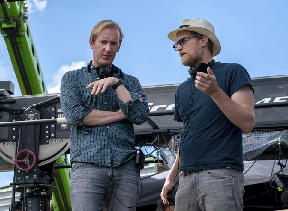 This image released by Amazon Studios shows showrunners Patrick McKay, left, and JD Payne on the set of "The Lord of the Rings: The Rings of Power." (Amazon Studios via AP)