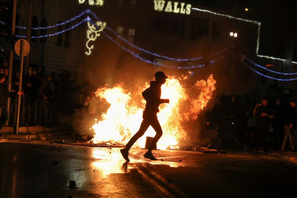 <p>Violence erupted by Damascus Gate, one of the entrances to the walled Old City</p> (Reuters)