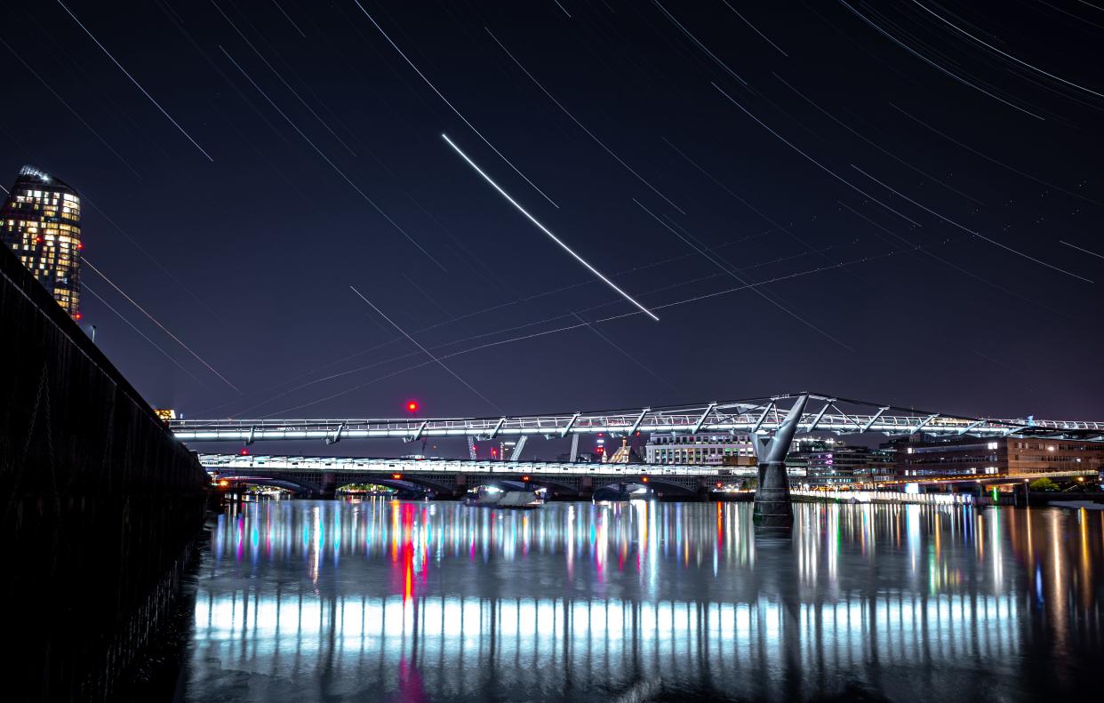 The London Millennium Footbridge can be seen on April 21, 2020 during the Lyrid meteor shower, an annual display caused by the Earth passing through a cloud of debris from a comet called C/186 Thatcher. Multiple exposures were combined in camera to produce this image.