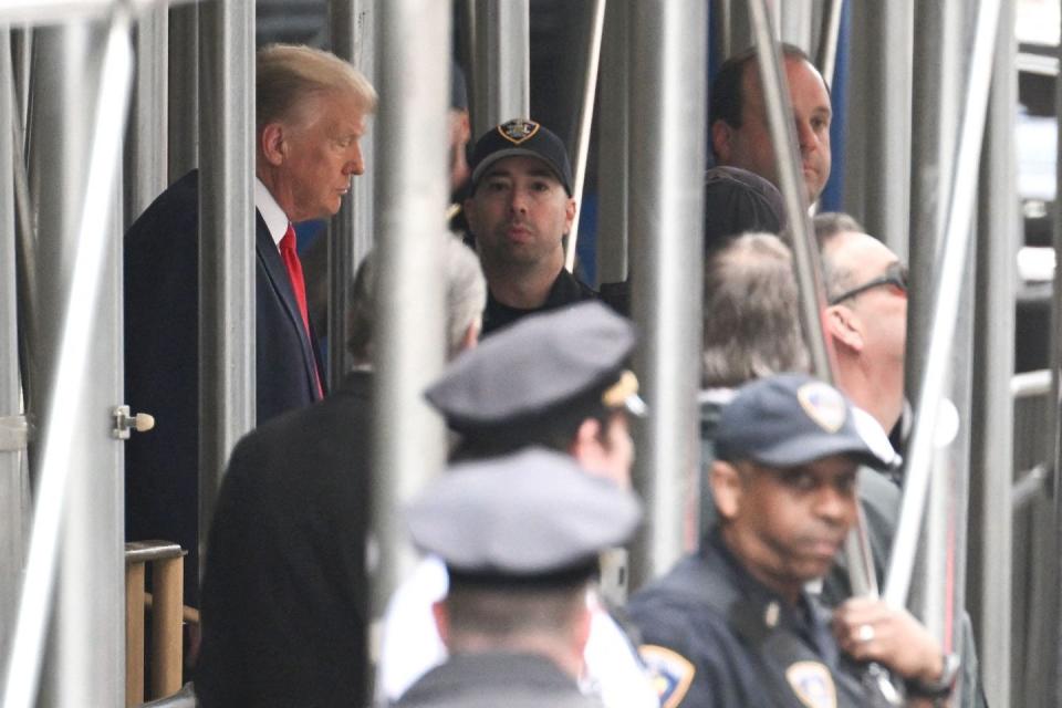 former us president donald trump leaves the manhattan criminal court in new york city on april 4, 2023 former us president donald trump is to be booked, fingerprinted, and will have a mugshot taken at a manhattan courthouse on the afternoon of april 4, 2023, before appearing before a judge as the first ever american president to face criminal charges photo by andrew caballero reynolds afp photo by andrew caballero reynoldsafp via getty images