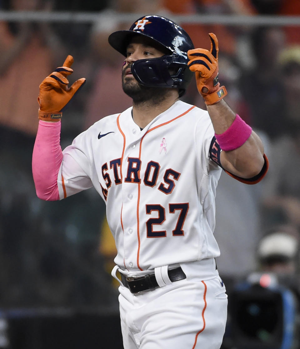 Houston Astros' Jose Altuve reacts after hitting a solo home run during the fourth inning of a baseball game against the Toronto Blue Jays, Sunday, May 9, 2021, in Houston. (AP Photo/Eric Christian Smith)
