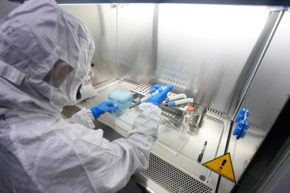 A technician examines the test kits for coronavirus at a company, Yangzhou city, east China's Jiangsu province, 17 February 2020.