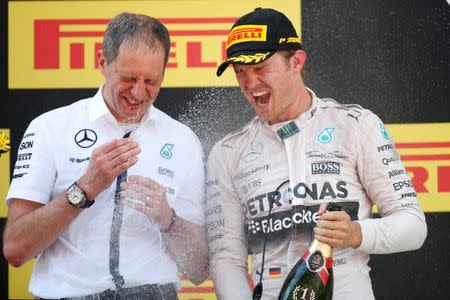 Formula One - F1 - Spanish Grand Prix 2015 - Circuit de Catalunya, Barcelona, Spain - 10/5/15 Mercedes' Nico Rosberg celebrates his win on the podium with Mercedes Race Engineer Tony Ross Reuters / Juan Medina