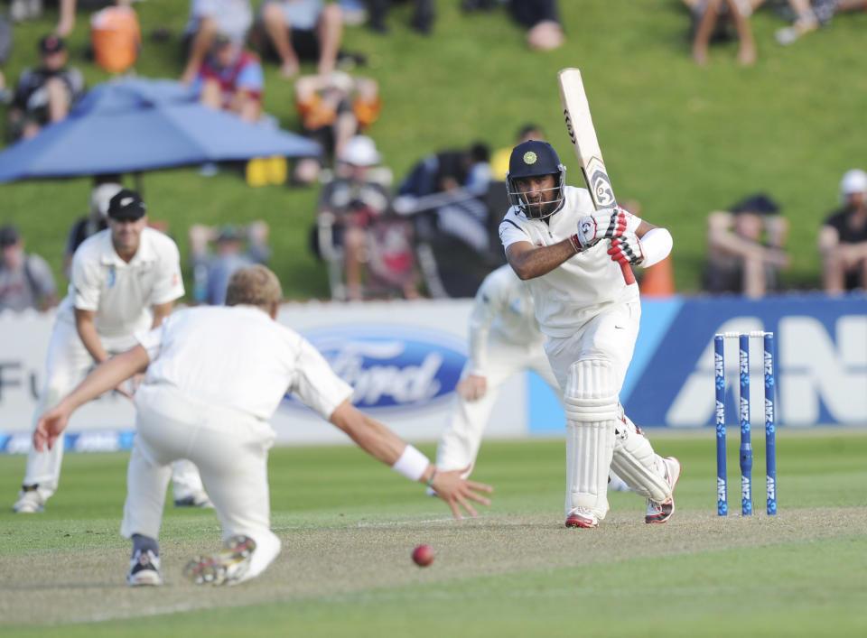 India’s Cheteshwar Pujara bats the ball pats New Zealand’s Neil Wagner on the first day of the second cricket test in Wellington, New Zealand, Friday, Feb. 14, 2014.