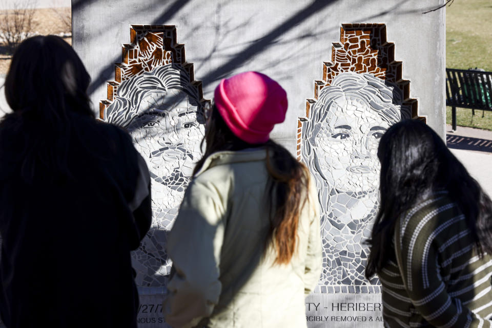 University of Colorado students look at the Los Seis de Boulder monument (Michael Ciaglo for NBC News)