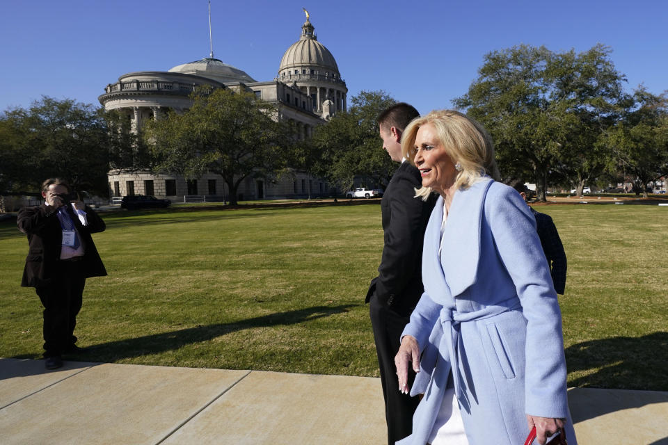 Mississippi Attorney General Lynn Fitch walks past the Mississippi State Capitol as the Capitol Police respond to a bomb threat at the statehouse and the Mississippi Supreme Court building in Jackson, Miss., Thursday morning, Jan. 4, 2024. The police were dealing with the second consecutive day of threats. (AP Photo/Rogelio V. Solis)