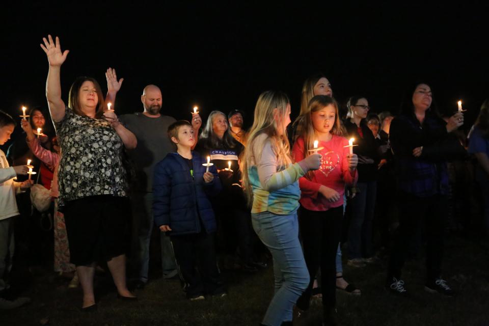 A vigil is held on Dec. 14, 2021, for the nine people who were killed when a tornado destroyed a candle factory in Mayfield, Kentucky.